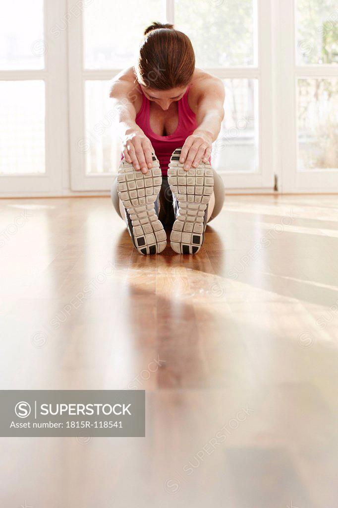 Germany Duesseldorf Mature Woman Exercising At Home SuperStock