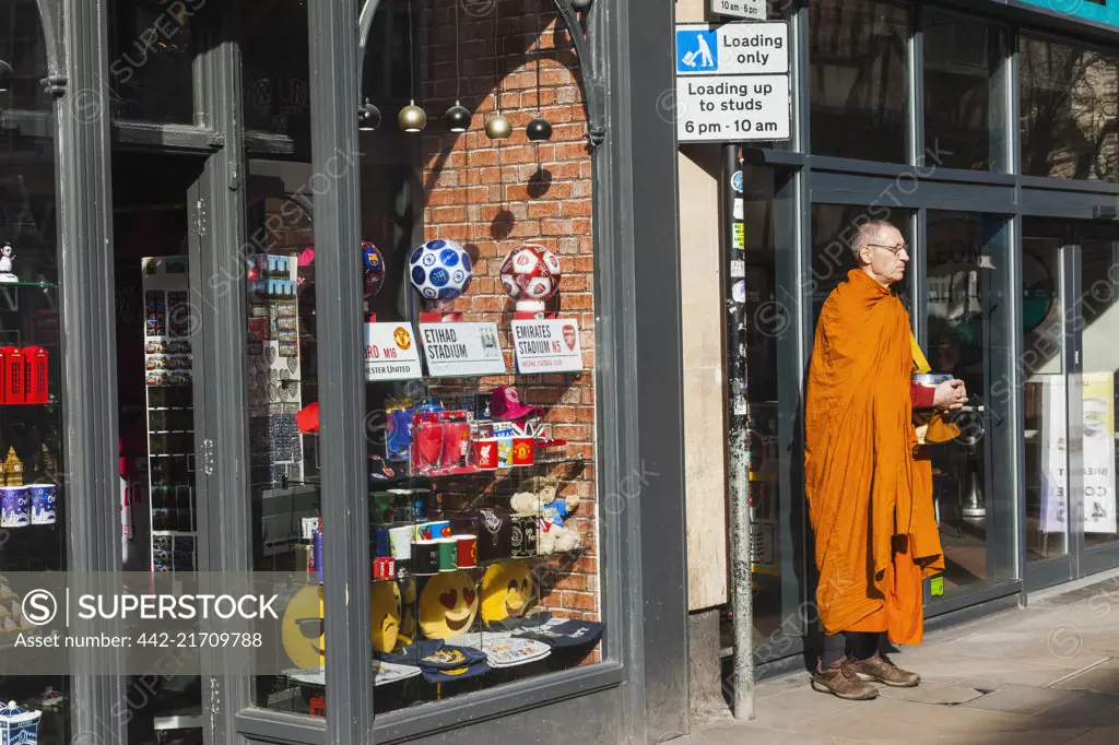 England Oxfordshire Oxford Buddhist Monk Collecting Alms SuperStock