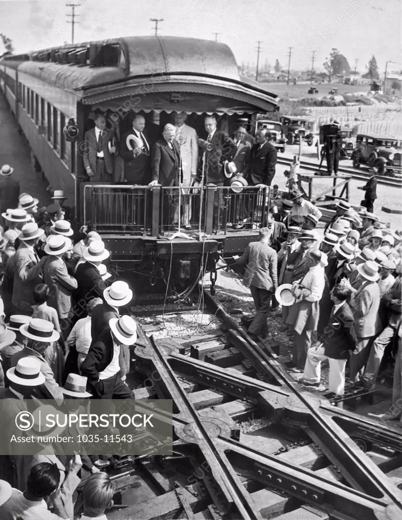 Los Angeles, California:  c. 1928. The unveiling of the 'continous rail' crossing in Los Angeles, which is a noiceless turntable to provide a continous rail at railroad crossings. It is called the greatest achievement in railroading since the invention of the block signal. It was secretly tested in LA for six months.