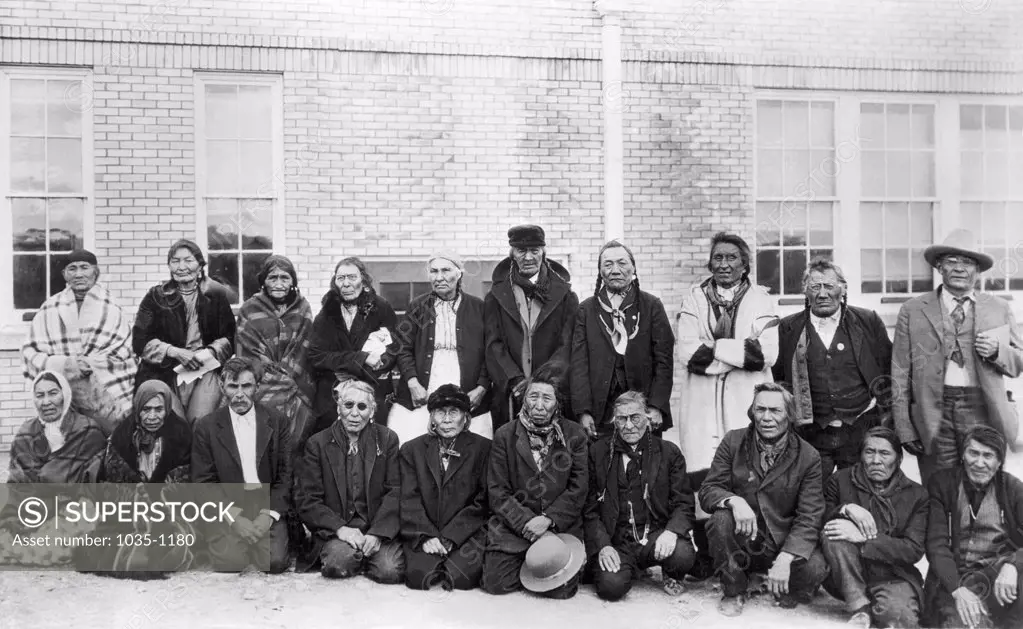 Group of senior people in front of a school