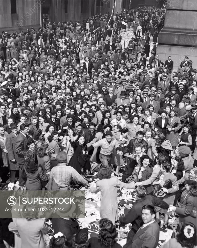 New York, New York:   May 7, 1945. An erroneous Associated Press announcement has New Yorkers celebrating VE-Day and dancing on Wall Street. The actual the end of WWII in Europe was not til the next day, May 8th.