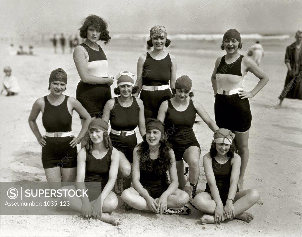 Portrait of a group of young women and teenage girls posing on the ...