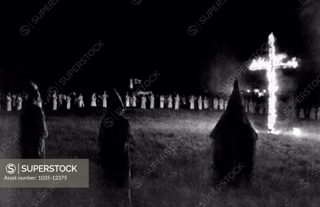 Pulaski, Tennessee:  May 31, 1976. A Ku Klux Klan cross burns at the 'bi-centennial' celebration. 1500 members from 28 states attended the gathering.