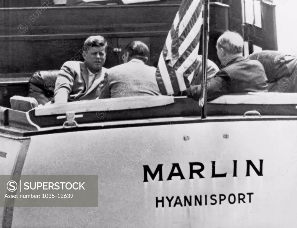 Hyannis Port, Massachusetts:  c. 1962  President Kennedy confers with top aides, Robert McNamara, Dean Rusk, and  Gen. Maxwell Taylor aboard the yacht Marlin in Nantucket Sound in Hyannis Port.