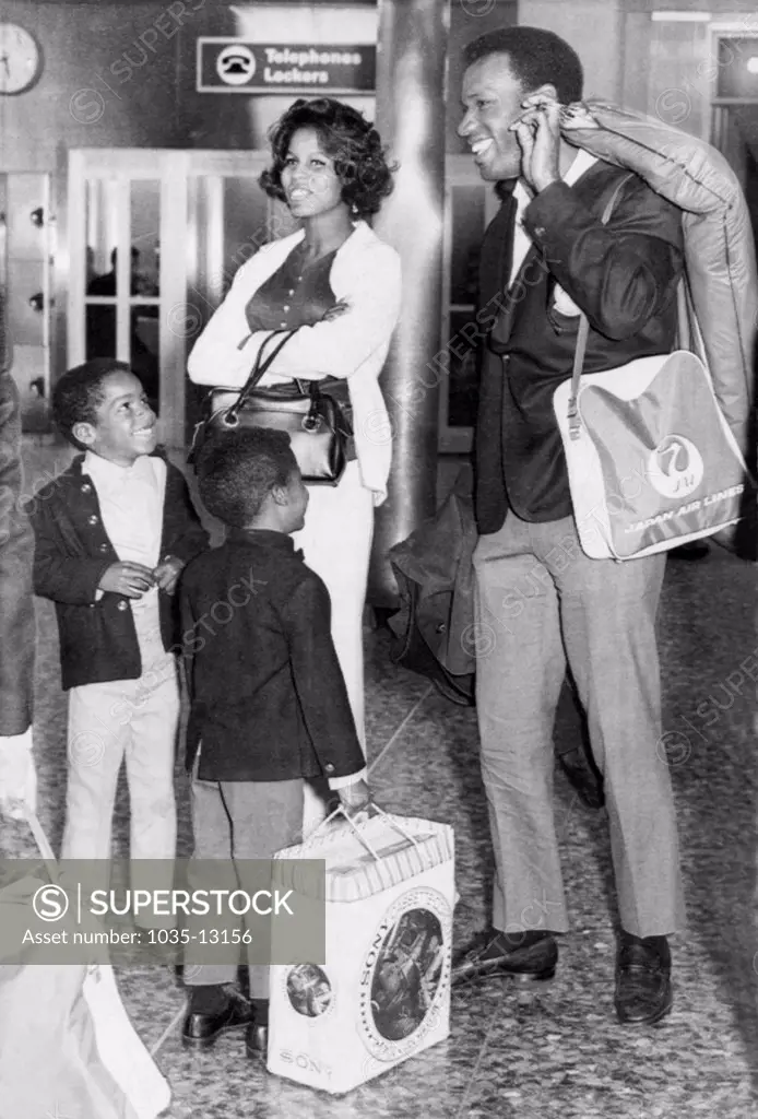 San Francisco, California:  March 31, 1970 Bobby Bonds of the San Francisco Giants returns from an exhibition baseball tour of Japan and is greeted at the SF airport by his wife, Pat, and his two sons, Barry (l) and Ricky (r).