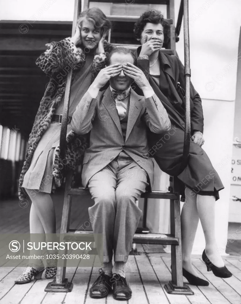 Seattle, Washington:  c. 1933 Three passengers enroute from the Orient to Seattle on the SS President Jefferson honor the traditional Japanese monkey gods of Hear, See, and Speak No Evil.