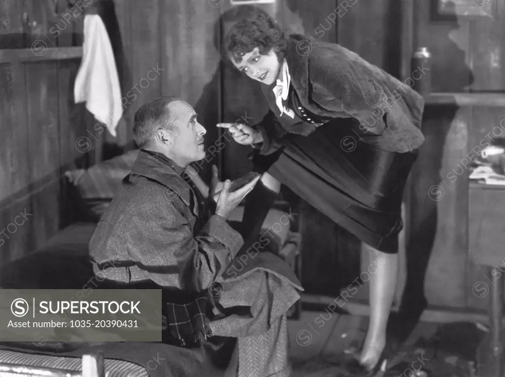 Hollywood, California:    1934 Actress Pert Kelton lays it down to James Gleason in the RKO film, "The Meanest Gal In Town".