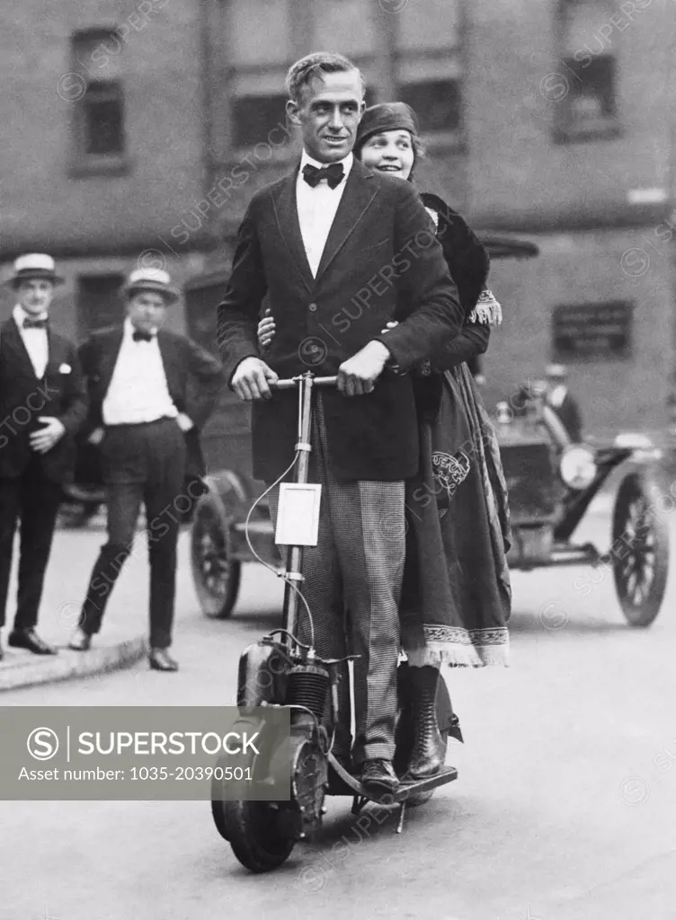 New York, New York:  c. 1923 A couple showing how they get to work on their autoped during the latest transit strike.