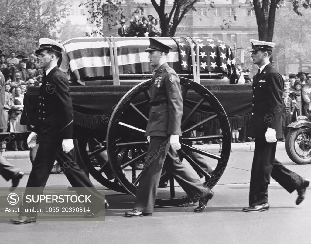 Washington, D.C.:    April 14, 1945 The caisson bearing the body of Franklin Delano Roosevelt proceeds with a military escort up Pennsylvania Avenue to the White House.