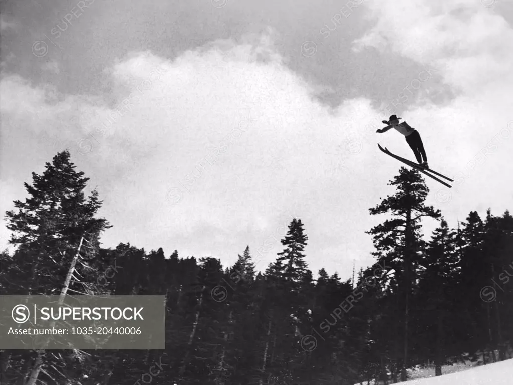 Big Pines, California:  January 27, 1937 Sigurd Ulland of the Lake Tahoe Ski Club, takes the leap off a mountain and takes home the prize in the Invitational International Ski Tournament ofr the second straight year.