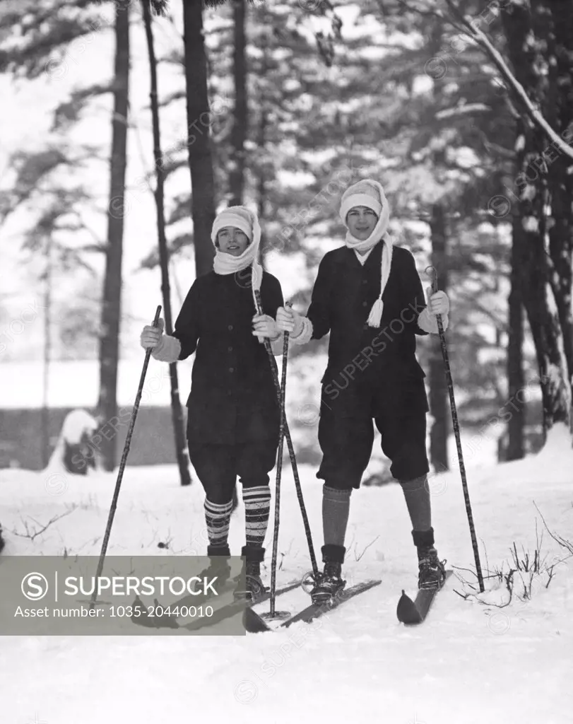 New York:  c. 1925 Two young women out for a day of skiing in the woods.