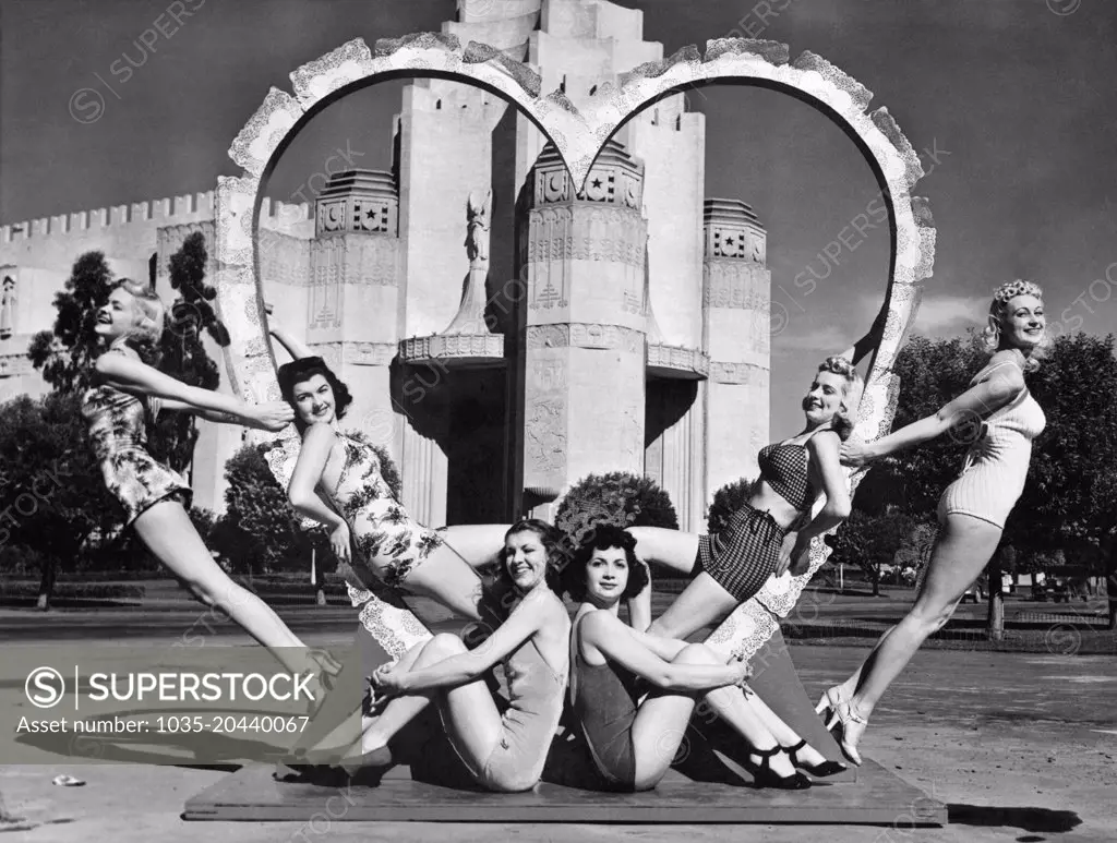 San Francisco, California:  February 14, 1940 These six young women are ready for St. Valentine's Day as they surround a heart at the South Tower of the Golden Gate International Exposition on Treasure Island.