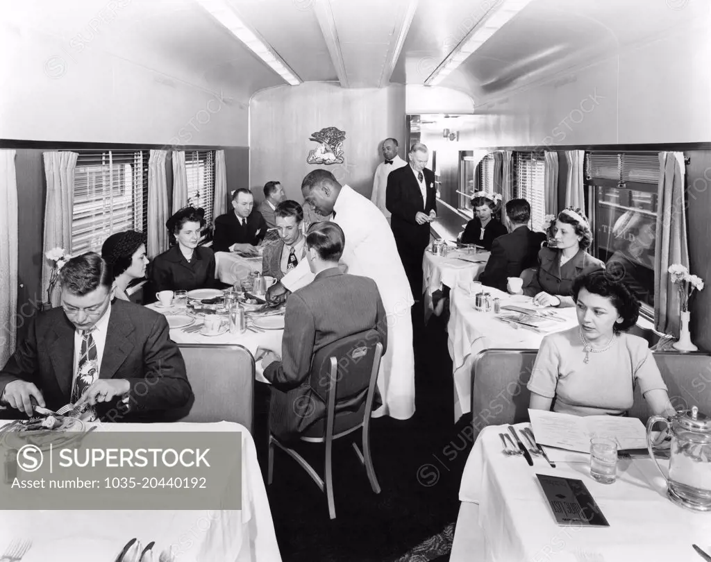 United States:  c. 1952 Passengers in the dining car on a Rio Grande streamliner train.