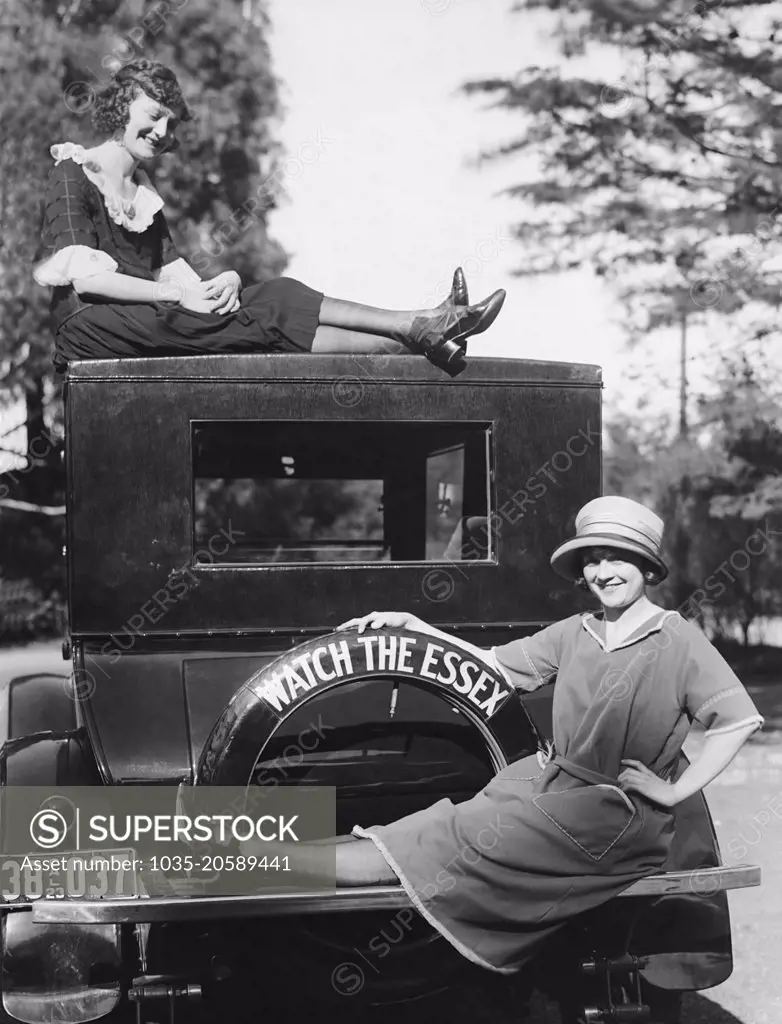 California:  1923 Two stylish young women with their Essex automobile.