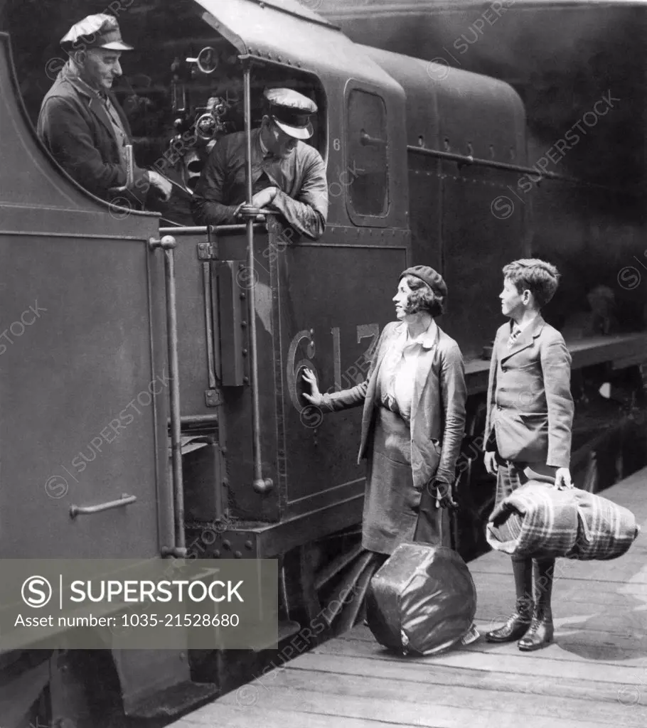 London, England: May 9, 1935 Two orphaned youngsters have traveled from Australia to England, and are now preparing to board the train at Euston Station that will take them to Scotland to live with an aunt.