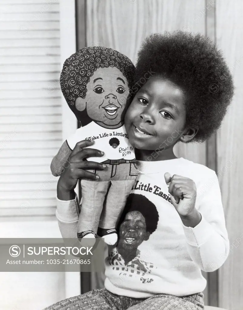 Los Angeles, California:  1974 A young girl holds her talking Rodney Allen Rippy doll who is the namesake of television's newest star.