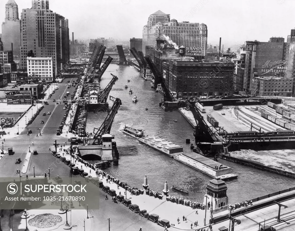 Chicago, Illinois:  1933 Barges from New Orleans arriving in Chicago on the Chicago River with Michigan Ave in the lower right corner.