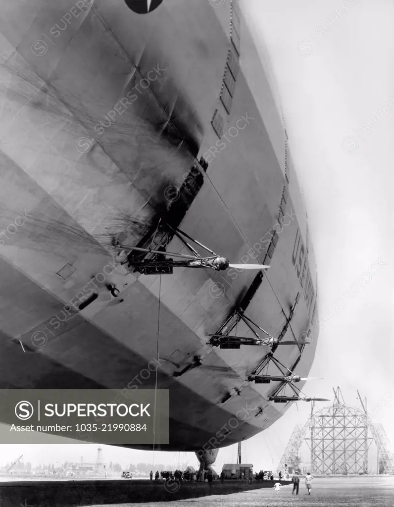 Mountain View, California, 1933 A U.S. Navy dirigible is at rest at Moffett Field. while Hangar One can be seeing under construction in the background.