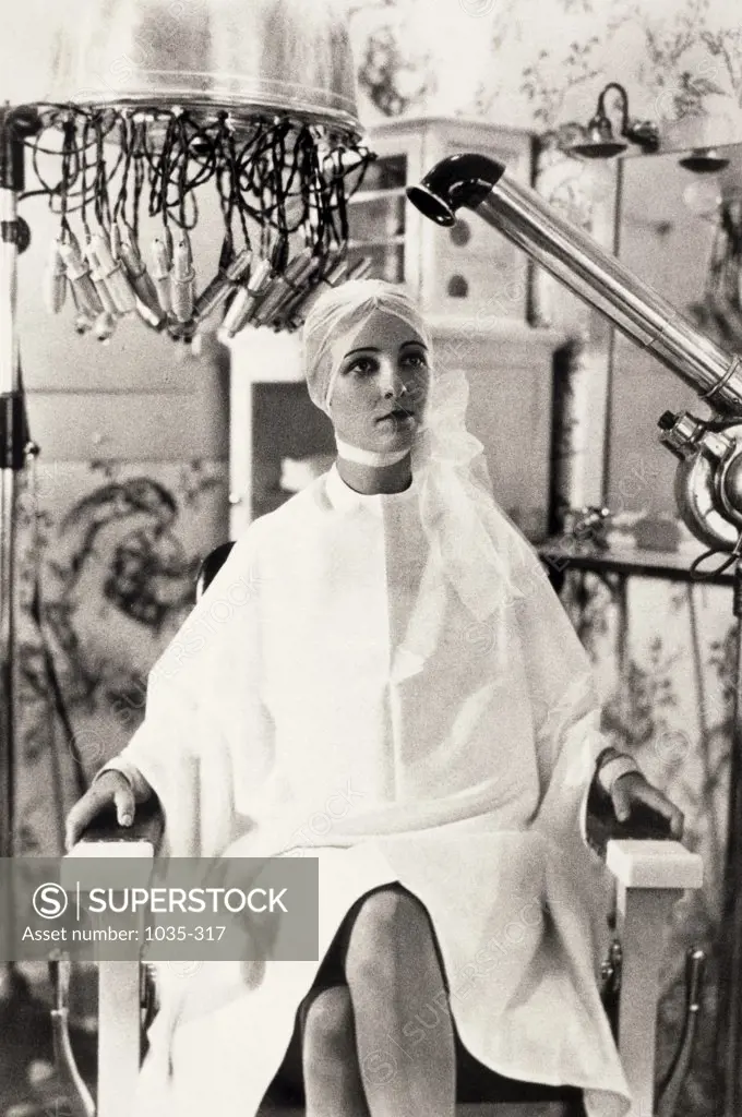 Young woman getting her hair dried in a hair salon