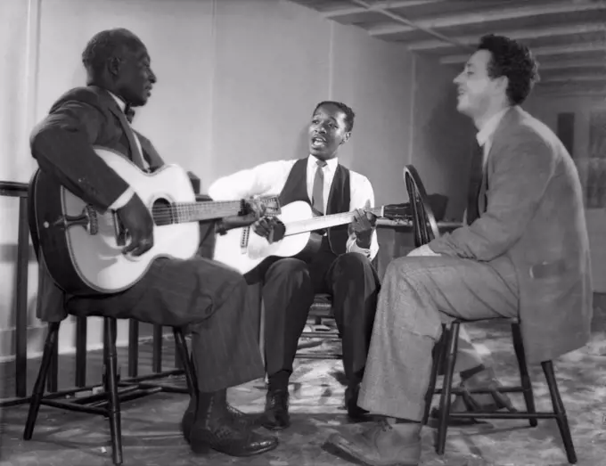 New York, New York:  c. 1940. L-R: Leadbelly, Josh White and Nicholas Ray. Ray became a film director; amongst his more notable films was 'Rebel Without A Cause', starring James Dean.