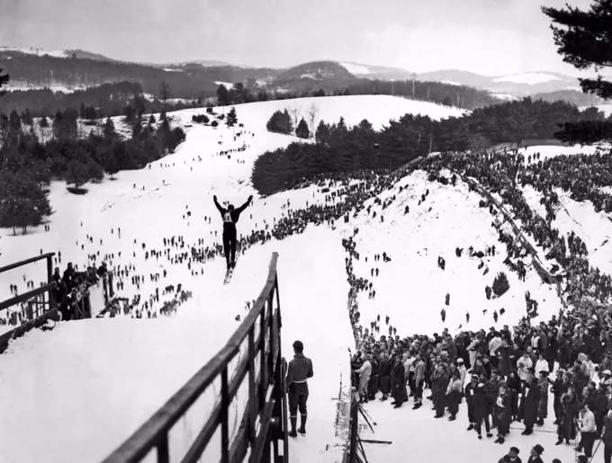 Hanover, New Hampshire:  February 6, 1937.  A view of the ski jump at the annual Winter Carnival of the Dartmouth Outing Club.  Shown here is Jarvis Schauffler of the Amherst Outing Club who was on the US Downhill Ski Team in the 1936 Olympics.