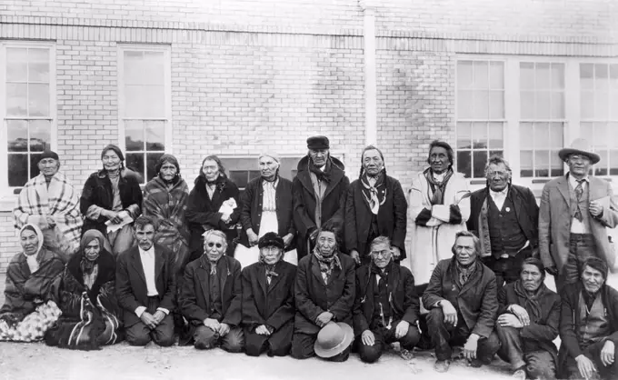 Group of senior people in front of a school