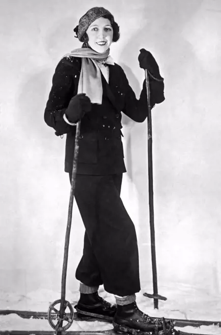 Paris, France:  c. 1930. The latest ski ensemble from Paris in a maroon flannel. The bonnet is in maroon and red.