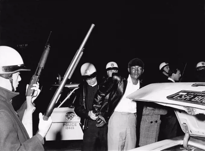 Los Angeles, California:  1966. A black man is arrested by police during a riot in Los Angeles.