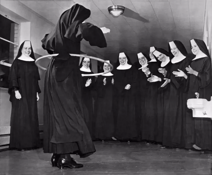 Oklahoma City, Oklahoma:  October 18, 1958. Benedictine Sisters at the Christ King Convent in Oklahoma City try their hand at the hula hoop craze that is sweeping the country.