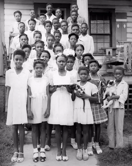 United States:  c. 1950 A large group of African American children pose for a protrait.