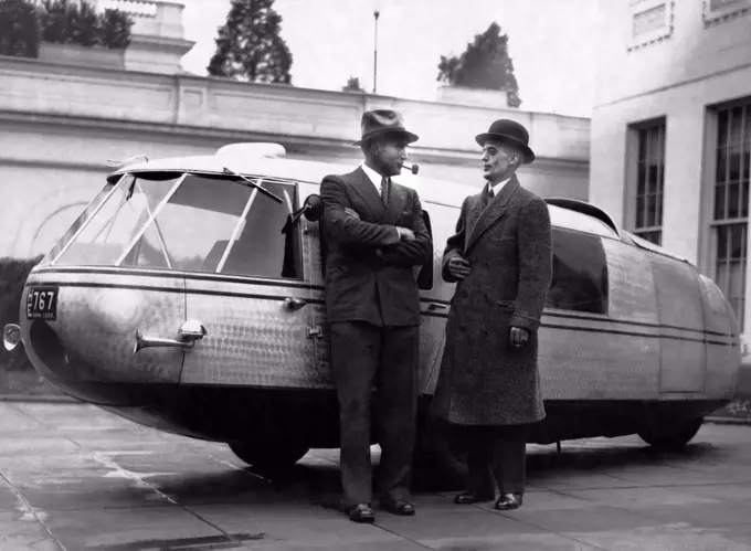 Washington, D.C.:  November 13, 1933 Captain Al Williams, noted speed flyer and driver, and Marvin McIntyre, Secretary to President Roosevelt, standing by the Dymaxion concept car designed by Buckminster Fuller.