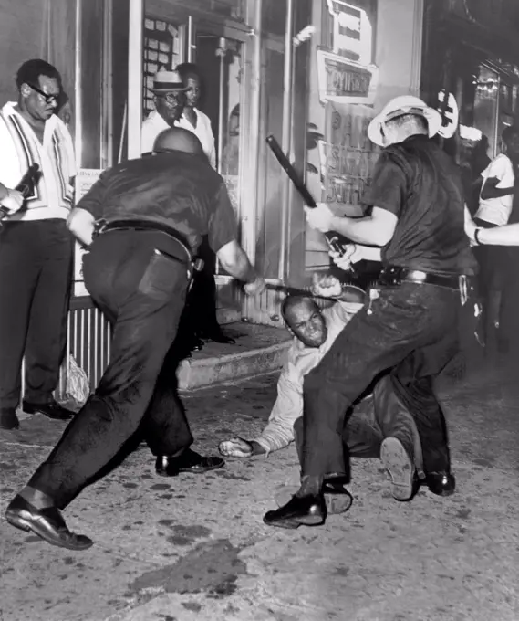 New York, New York:  1964 An incident at 133rd St. and Seventh Ave in Harlem after the Powell shooting. The shooting touched off scenes like this in the streets of Harlem last night as it was torn by disorder for second time.