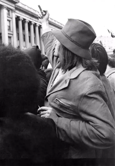 United States:  c. 1969 A protester gives the finger at an anti Vietnam war demonstration