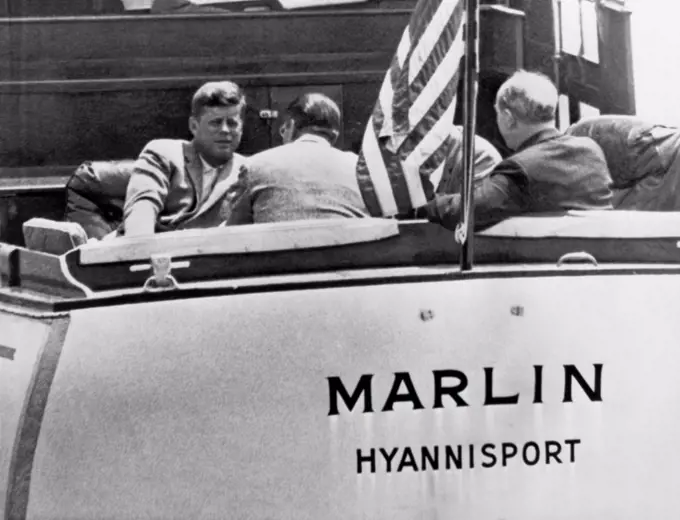 Hyannis Port, Massachusetts:  c. 1962  President Kennedy confers with top aides, Robert McNamara, Dean Rusk, and  Gen. Maxwell Taylor aboard the yacht Marlin in Nantucket Sound in Hyannis Port.