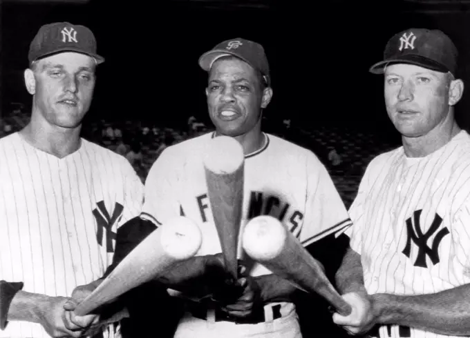 New York, New York:  July 24, 1961. Slugging outfielders before an exhibition game at Yankee Stadium. L-R: Roger Maris, Yankees, Willie Mays, Giants, and Mickey Mantle, Yankees.