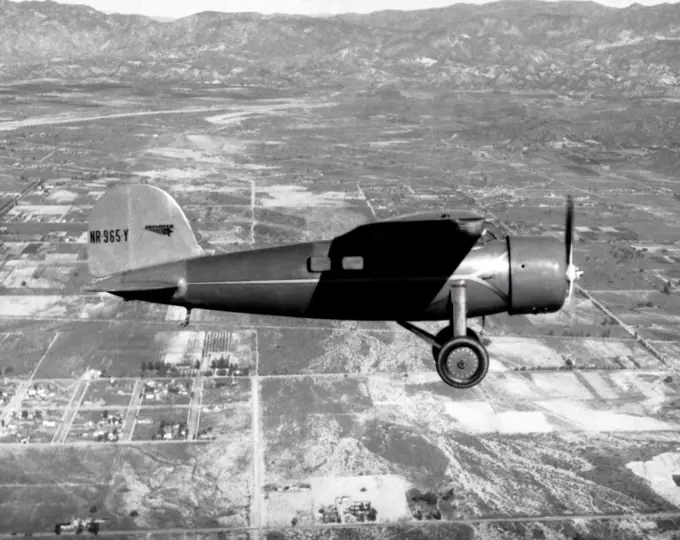 Burbank, California:  1934 Amelia Earhart in her Lockheed Vega plane flying over Burbank. She later flew the same plane from Honolulu to Oakland.