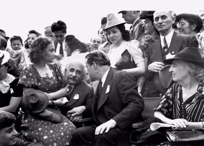 New York, New York:  1939 Albert Einstein with his daughter on his lap at the opening of the Jewish Pavillion at the World's Fair in Flushing Meadows in Queens. Grover Whalen is is leaning to talk to him.