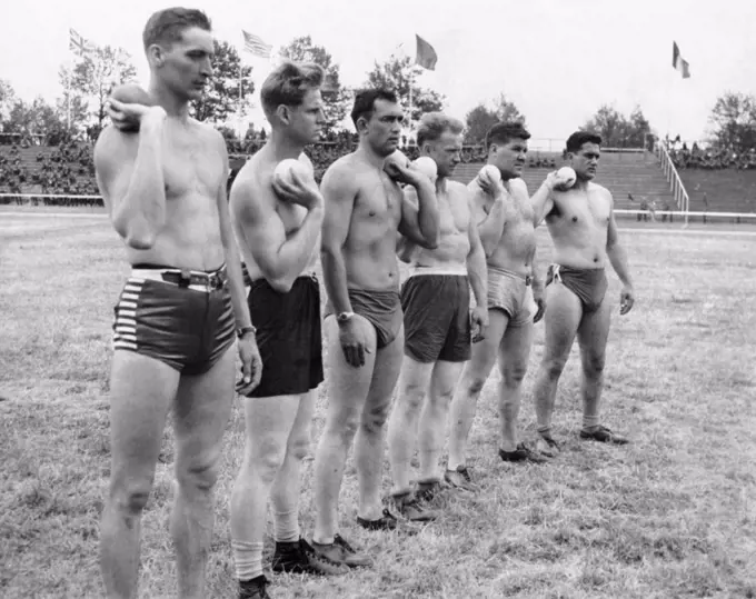 Dusseldorf, Germany:  June 15, 1945 Members of the Army's 94th Division line up for the shot put event at the track and field meet being held at the former Adolph Hitler Sport Platz.