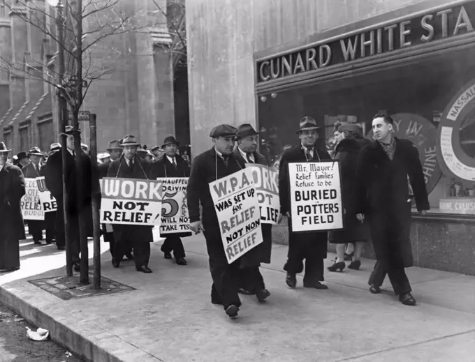 New York, New York:  April 9, 1939 WPA pickets marching along Fifth Avenue on Easter Sunday protesting Work Progress Administration policies.