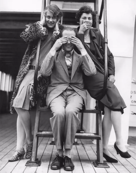 Seattle, Washington:  c. 1933 Three passengers enroute from the Orient to Seattle on the SS President Jefferson honor the traditional Japanese monkey gods of Hear, See, and Speak No Evil.