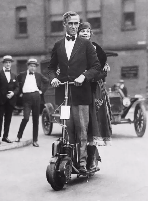 New York, New York:  c. 1923 A couple showing how they get to work on their autoped during the latest transit strike.