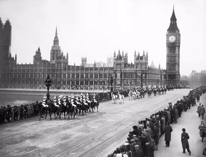 London, England:   May 6, 1939 The King and Queen and other members of the Royal Family in the Royal Procession over Westminster Bridge on their way to Waterloo Station today. They are leaving to visit Canada and The U.S.