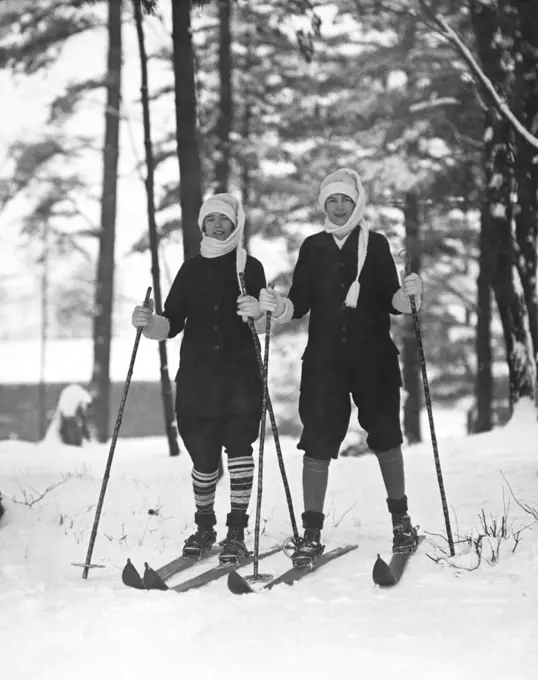 New York:  c. 1925 Two young women out for a day of skiing in the woods.