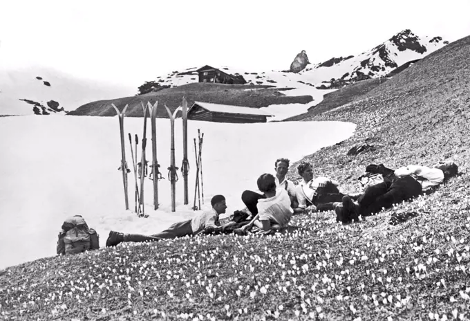 Arosa, Switzerland:   c.  1930 Skiing in the springtime in the Grisons in Switzerland has the side benefit of relaxing in the crocuses.