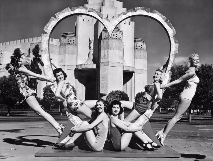 San Francisco, California:  February 14, 1940 These six young women are ready for St. Valentine's Day as they surround a heart at the South Tower of the Golden Gate International Exposition on Treasure Island.