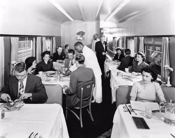 United States:  c. 1952 Passengers in the dining car on a Rio Grande streamliner train.