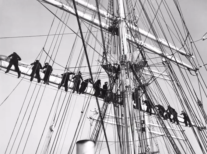 New York, New York:  March 3, 1937 Sailors on the Finnish training ship, "Swan of Finland" go through their drill atop the rigging. The ship is visiting New York for four days.