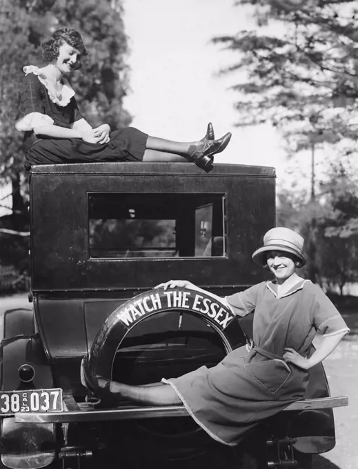 California:  1923 Two stylish young women with their Essex automobile.