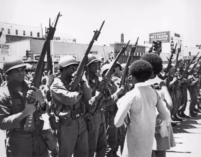 Berkeley, California:  May, 1969 African American women confront black National Guardsmen called in by Ronald Reagon to quell the People's Park protests.