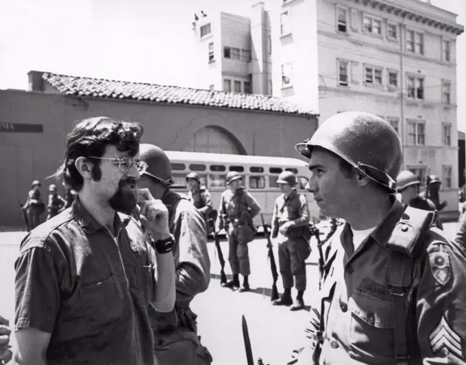 Berkeley, California:  May, 1969 A protester and a National Guardsman with a fixed bayonet called in by Ronald Reagon to quell the People's Park protests look quizically at each other.